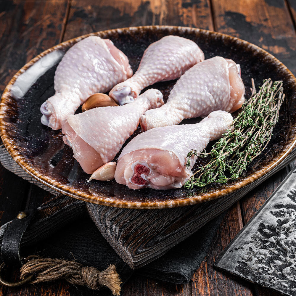Raw pasture-raised chicken drumsticks