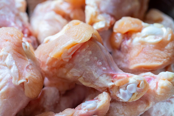 Close view of raw pasture-raised chicken wings