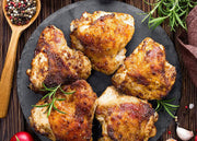 Cooked pasture-raised chicken thighs with crisp skin
