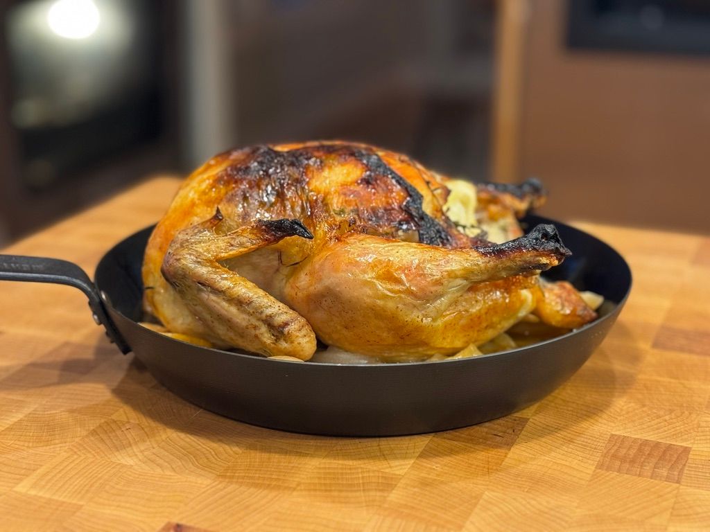 Whole roasted pasture-raised chicken with browned skin